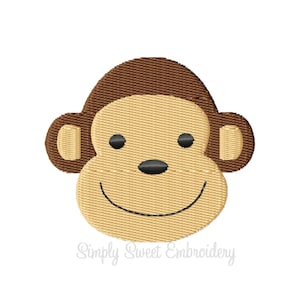 May include: A brown and beige embroidered monkey face with a smiling expression. The monkey has brown ears and a brown head.