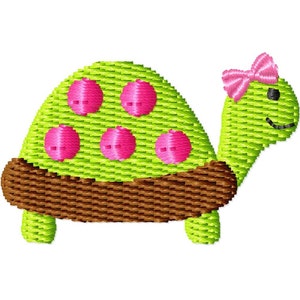 May include: A green turtle with pink polka dots and a pink bow on its head. The turtle has a brown shell and is embroidered.