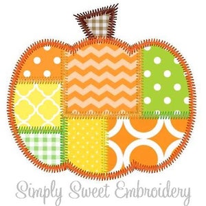 May include: A patchwork pumpkin applique design with a variety of colors and patterns, including orange, yellow, green, and white. The pumpkin is outlined in orange thread and has a brown stem.