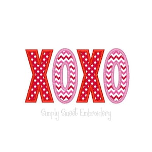 May include: Embroidered "XOXO" in red and pink with polka dot and chevron patterns. The letters are outlined in red.