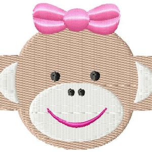 May include: Embroidered design of a monkey face with a pink bow. The monkey has a white face with black eyes and a pink smile.