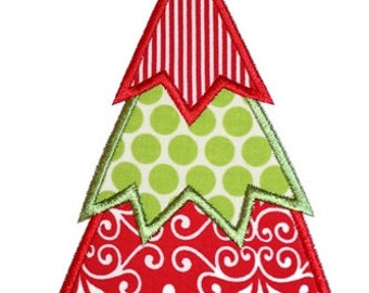 May include: A red, green, and white patchwork Christmas tree with a yellow star on top. The tree is made of different fabrics with polka dots, stripes, and a swirl pattern.