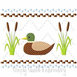 May include: Embroidered design of a brown duck with a green head, surrounded by two green reeds with brown stalks. The design is framed by a brown and white border with the text "Simply Sweet Embroidery" at the bottom.