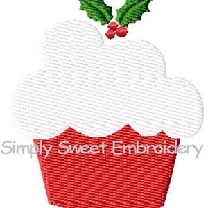 May include: Red and white Christmas cupcake with green holly leaves and red berries on top. The cupcake is decorated with white frosting and has a red base. The text "Simply Sweet Embroidery" is visible at the bottom of the image.