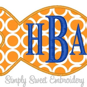 May include: Orange and white fish-shaped patch with a blue embroidered monogram "HBA" in the center. The patch is outlined in gold thread.