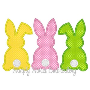 Può includere: Tre forme di coniglio ricamate in giallo, rosa e verde con pois bianchi. Ogni coniglio ha un cerchio bianco per la coda.