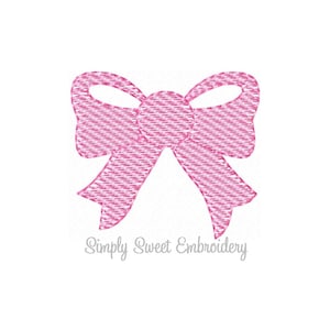 May include: Pink bow with a striped pattern. The bow is a digital embroidery design.
