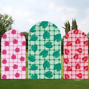May include: Three arched backdrop panels featuring distinct patterns. The left panel has a pink plaid background with pink hibiscus flowers. The center panel has a green plaid background with green leaves. The right panel has a red plaid background with red anthurium flowers.