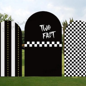 May include: Three arched party decorations with racing themes. The left panel has white stripes with yellow dashed lines on a black background. The center panel is black with the text "TWO FAST" and a white checkered border. The right panel has a black and white checkered pattern.