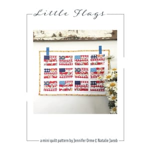 May include: A mini quilt pattern called "Little Flags" by Jennifer Orme & Natalie Jacob. The quilt features 12 small American flag designs in red, white, and blue fabrics.