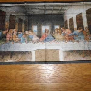 May include: A painting depicting The Last Supper, a famous Renaissance artwork by Leonardo da Vinci. The painting shows Jesus Christ and his twelve disciples gathered around a table for a meal. The painting is set in a long, rectangular room with a vaulted ceiling. The figures are depicted in a realistic style, with detailed expressions and gestures. The painting is a masterpiece of Renaissance art and is one of the most famous and influential works of art in history.