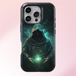 May include: A black phone case featuring a green and black image of a hooded figure holding a glowing orb. The figure is set against a starry backdrop.
