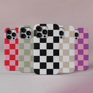May include: Five different phone cases with checkered patterns. The cases are in pink, green, black and white, beige, and purple. The cases are all for the same model phone and have a similar design.