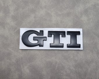 May include: Black and white "GTI" logo on a white background.