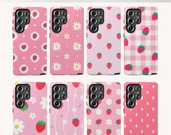 May include: A collection of pink phone cases with strawberry and daisy patterns. The cases feature various designs, including strawberries on a polka dot background, daisies, and a gingham pattern. The text "Strawberry Fun Phone Cases" is at the top.