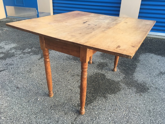 An American Stained Pine Drop Leaf Table An American Stained Pine Drop Leaf Table
