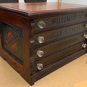 Antique Walnut Willimantic spool cabinet 4 drawers glass knobs 15H16.5D24.75W Shipping is not free