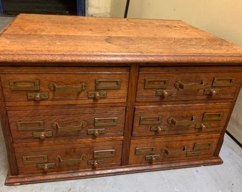 Antique 1892 solid oak six drawer paneled file cabinet brass labels 27w20d15h Shipping is not free