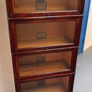 Antique Globe Wernicke three-quarter size oak 4 section barrister bookcase 25.5w12d60h Shipping is not