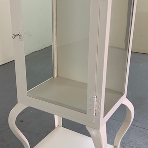 Beautiful antique medical doctor hospital cabinet white painted iron 19d24w54h Shipping is not free