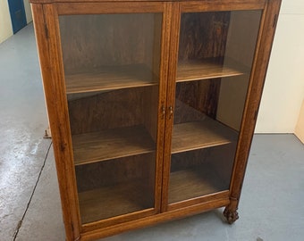 Antique solid oak two-door bookcase claw feet four shelves 48W16.5 D61H Shipping is not free