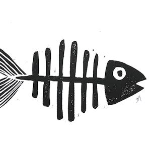 May include: Black and white illustration of a fish skeleton. The fish skeleton is a stylized design with a head, eye, and tail fin. The image is on a white background.