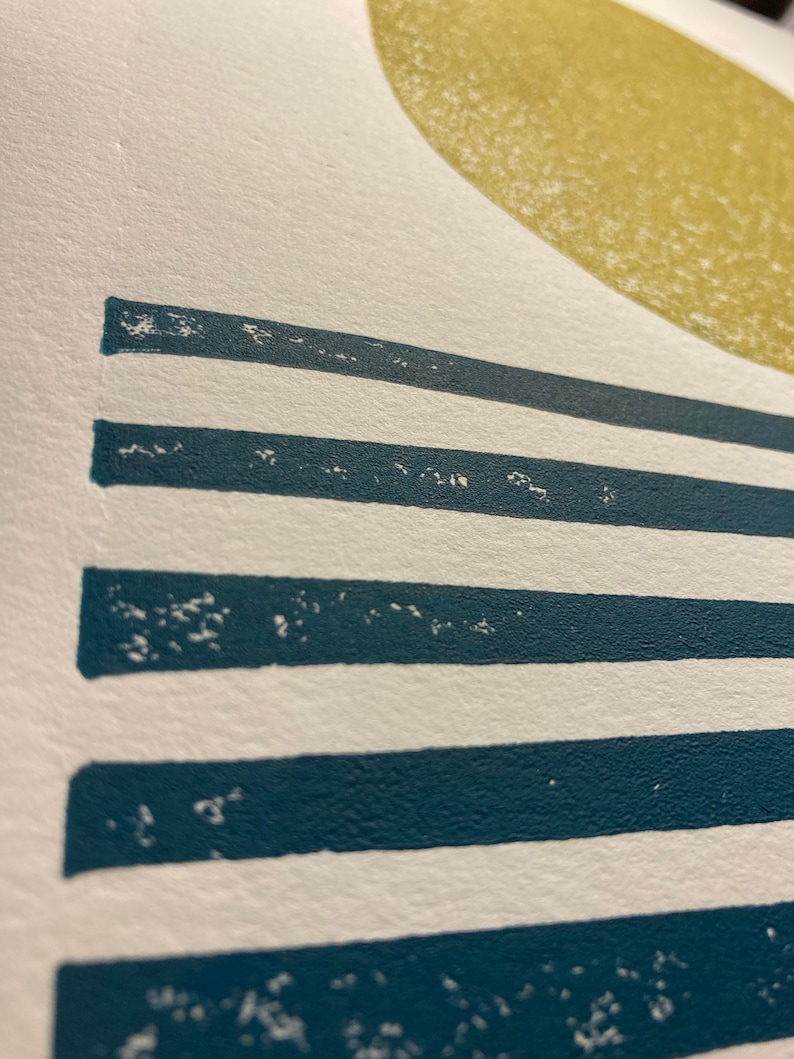 May include: A white background with a large yellow circle at the top and five horizontal teal blue stripes below the circle.