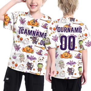 May include: A white short-sleeve button-down baseball jersey featuring a repeating Halloween pattern of pumpkins, ghosts, black cats, bats, mummies, and candy. The front displays the text TEAMNAME and the back shows YOURNAME with the number 00.