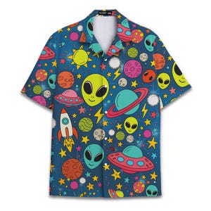 May include: Short-sleeved button-down shirt with a vibrant space-themed pattern. The design features colorful planets, rockets, UFOs, stars, and smiling green aliens on a blue background. The shirt has a classic collar and a relaxed fit.