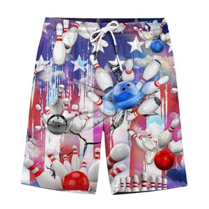 May include: Bowling-themed shorts featuring a vibrant design with bowling pins, balls, and an American flag motif. The shorts have a drawstring waistband and a colorful, eye-catching print. The design includes red, white, and blue colors.
