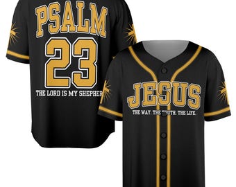 May include: Black baseball jersey with gold trim and lettering. The back displays "PSALM 23" and "THE LORD IS MY SHEPHERD". The front features "JESUS" and "THE WAY. THE TRUTH. THE LIFE."