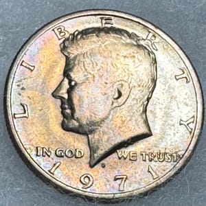 1971 D Kennedy Half Dollar Double Die Obverse “In God” We Trust with beautiful golden toning with subtle shades of blue and orange