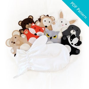 以下が含まれることがあります： 白いフェルトの手袋に、さまざまな動物の人形が取り付けられています。動物の人形には、クマ、キツネ、ハリネズミ、フクロウ、ウサギ、アライグマ、アナグマが含まれています。人形はすべてフェルト製で、刺繍が施されています。手袋の人形は、想像力豊かな遊びや物語を語るのに最適です。