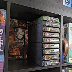 In a standard Ikea kallax shelf, you can even store 5 battle boxes behind the storage cases!