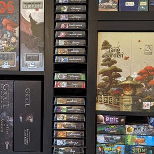 Store your games in gaps between shelves!