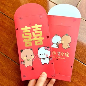 Schattige cartoon beer Bubu en Dudu Chinees pasgetrouwd rood zak, gouden geluk rode envelop, nieuw huwelijk traditie Hong Bao Aziatisch huwelijkscadeau