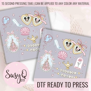 May include: A set of 10 iron-on transfers featuring a pink and blue color scheme with Disney characters and symbols. The transfers include Mickey Mouse, Minnie Mouse, Cinderella's glass slipper, a magic lamp, a castle, and a rose in a glass dome. The text "Magical World" is included in the design. The transfers are ready to press with a heat press or iron.