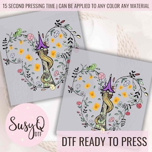 May include: Two DTF (Direct to Film) ready-to-press transfers featuring a cartoon illustration of a tower with long blonde hair, surrounded by flowers and lanterns. The text "DTF READY TO PRESS" is at the bottom.