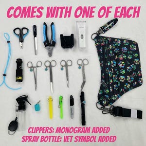 May include: A grooming kit for pets, including clippers, scissors, a spray bottle, and a small bag with a paw print design. The text "COMES WITH ONE OF EACH" is at the top of the image. The text "CLIPPERS: MONOGRAM ADDED" and "SPRAY BOTTLE: VET SYMBOL ADDED" is at the bottom of the image.