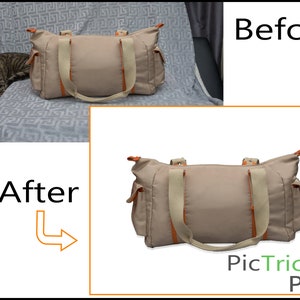 May include: A beige canvas tote bag with orange trim and two beige straps. The bag has a zipper closure and a small pocket on the front.