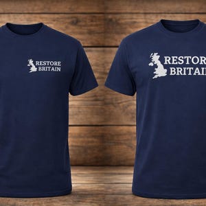 May include: Two navy blue t-shirts, each bearing the white text "RESTORE BRITAIN" and a white outline of the UK. The shirts are presented against a backdrop of wooden planks.