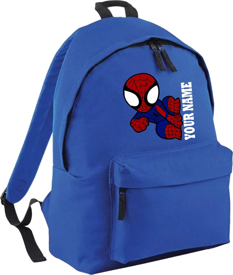 May include: Blue backpack featuring a cartoon Spider-Man graphic. The backpack has a front pocket and two zippered compartments. The text "YOUR NAME" is printed vertically on the side. The Spider-Man graphic is red, blue, and white.