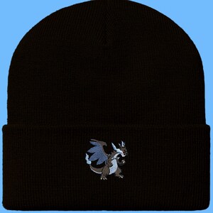 May include: Black beanie with an embroidered image of a blue and grey dragon.