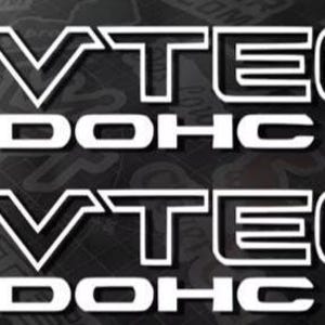 May include: Two white vinyl stickers with the text "i-VTEC DOHC" in a bold, blocky font. The stickers are on a black background.