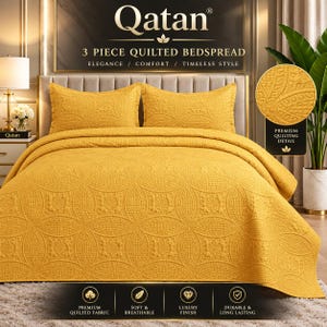 May include: A 3-piece mustard yellow quilted bedspread set featuring a repeating circular geometric pattern. The set includes a large bedspread and two matching pillow shams, all displaying a textured, stitched design throughout the fabric.