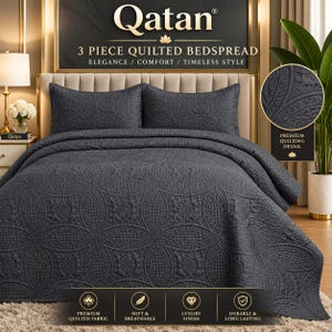 May include: A dark grey 3-piece quilted bedspread set featuring a repeating circular pattern with intricate stitching. The set includes a large bedspread and two matching pillow shams, all displaying a consistent textured design.