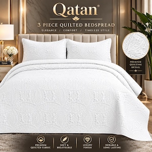 May include: A white three-piece quilted bedspread set featuring a repeating circular pattern. The set includes a large bedspread and two matching pillow shams, all displaying a textured, stitched design with a consistent white finish.