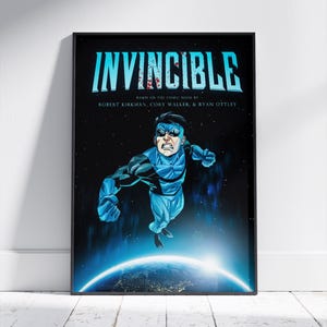 May include: A framed poster with the title "INVINCIBLE" in blue and red. The text below reads "BASED ON THE COMIC BOOK BY ROBERT KIRKMAN, CORY WALKER, & RYAN OTTLEY." The image shows a superhero in a blue and black suit, flying above a planet with a bright light.