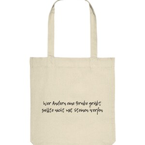 Celui qui creuse une fosse pour les autres est noir - Sac fourre-tout bio