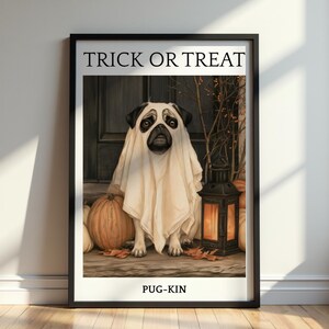 May include: A framed wall art print featuring a pug wearing a white ghost costume. The text TRICK OR TREAT appears at the top and PUG-KIN at the bottom. The scene includes orange pumpkins, a lit black lantern, and autumn leaves on a porch.